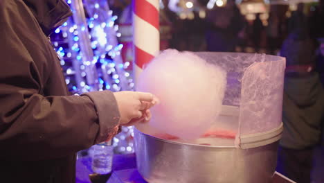 Woman-making-pink-candy-floss-slow-motion-Christmas-market-Montpellier-France.